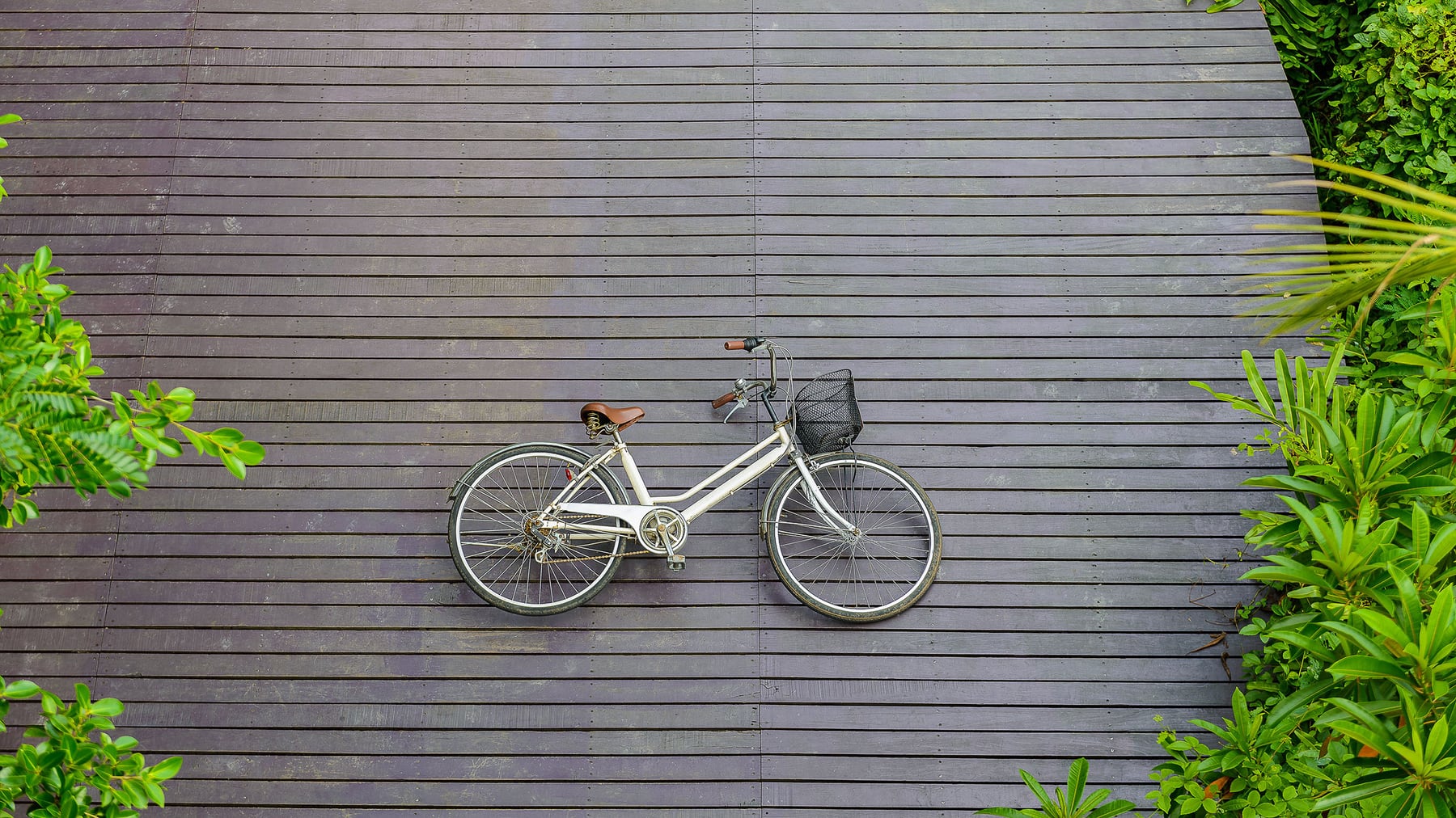 Vintage bicycle on wooden floor at Sri Nakhon Khuean Khan Park a