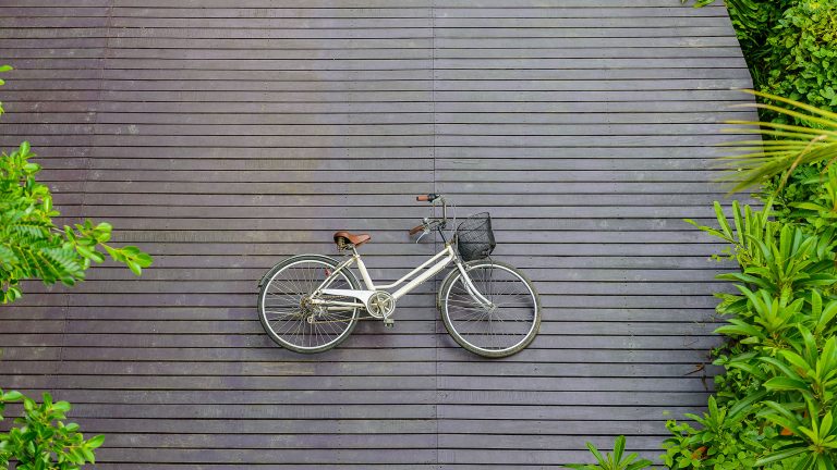 Vintage bicycle on wooden floor at Sri Nakhon Khuean Khan Park a